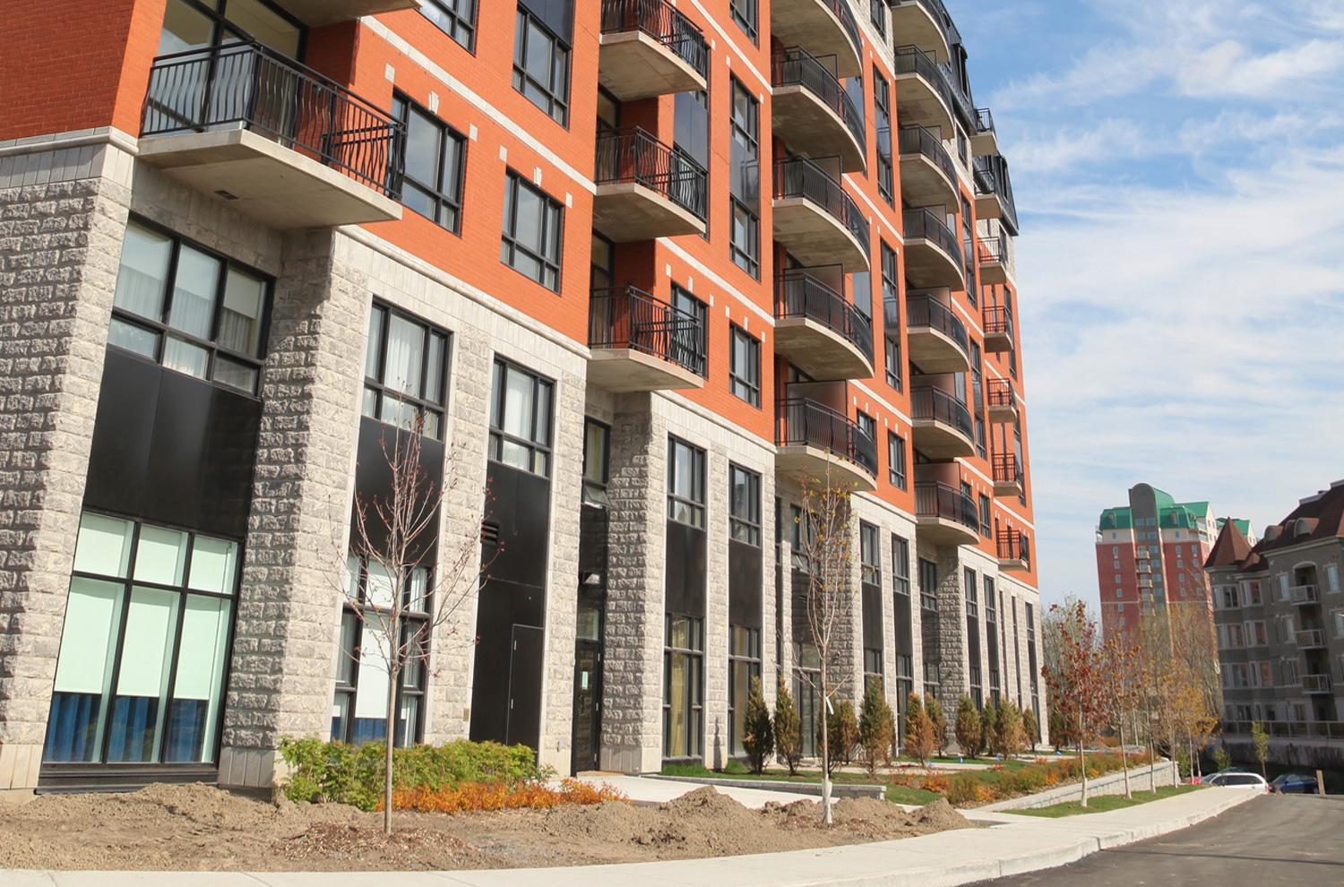 Brick condominium exterior facade on a sunny day