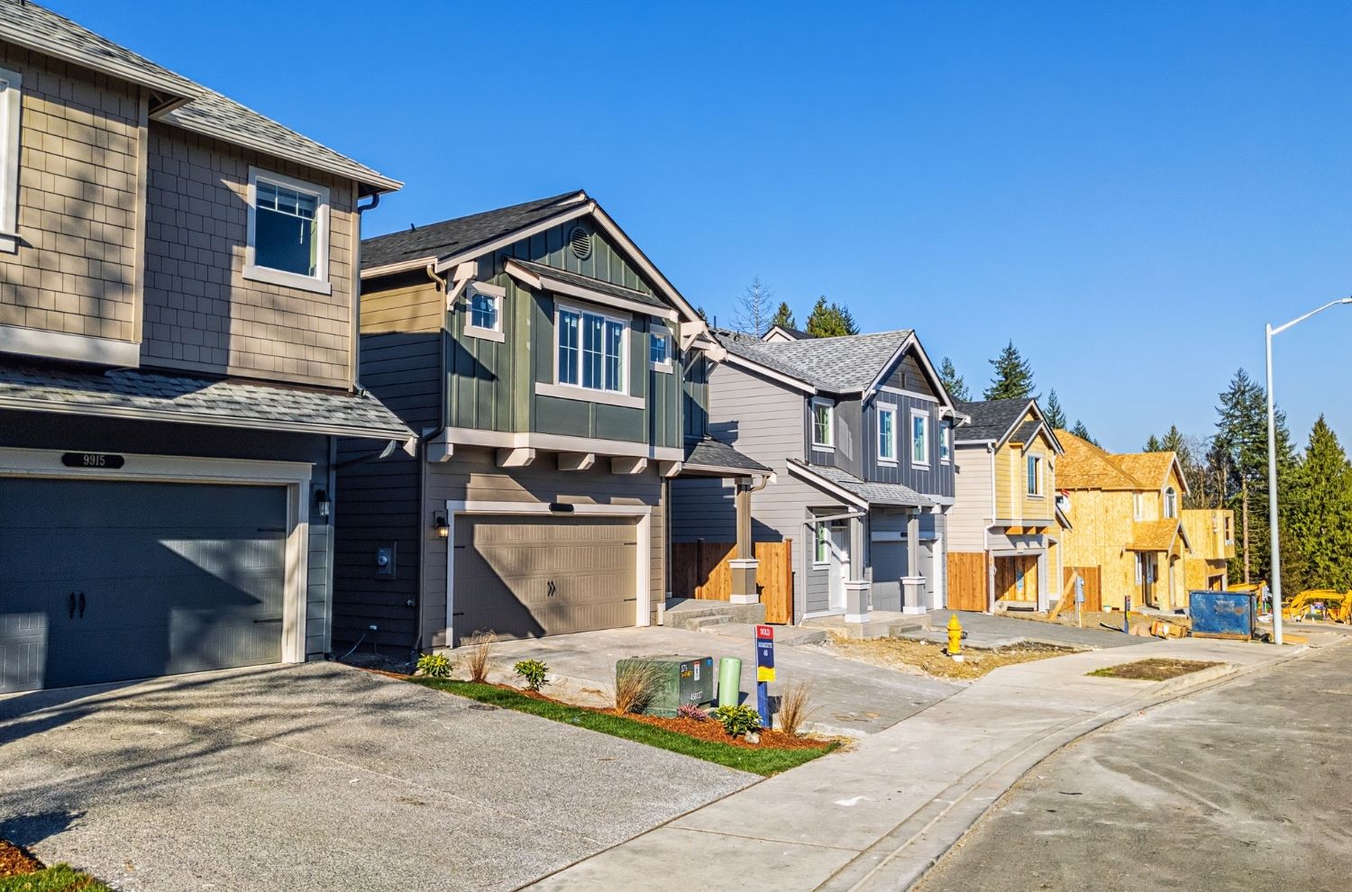 Row of homes under construction in subdivision