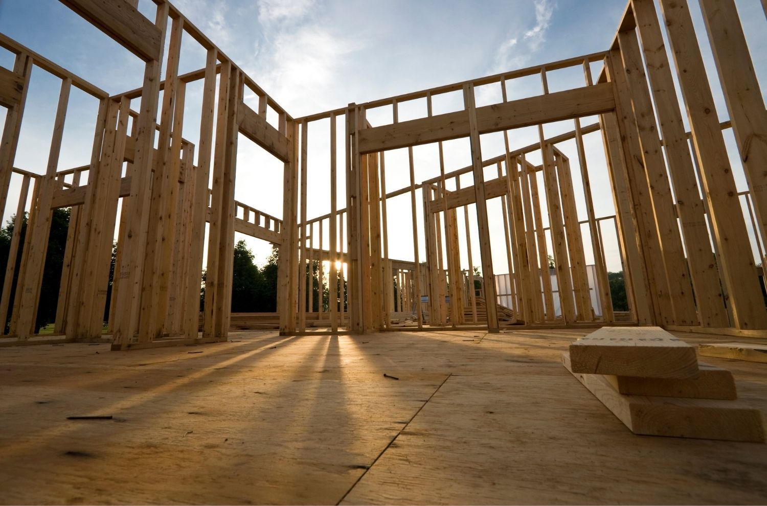 Interview view of house under construction in framing stage