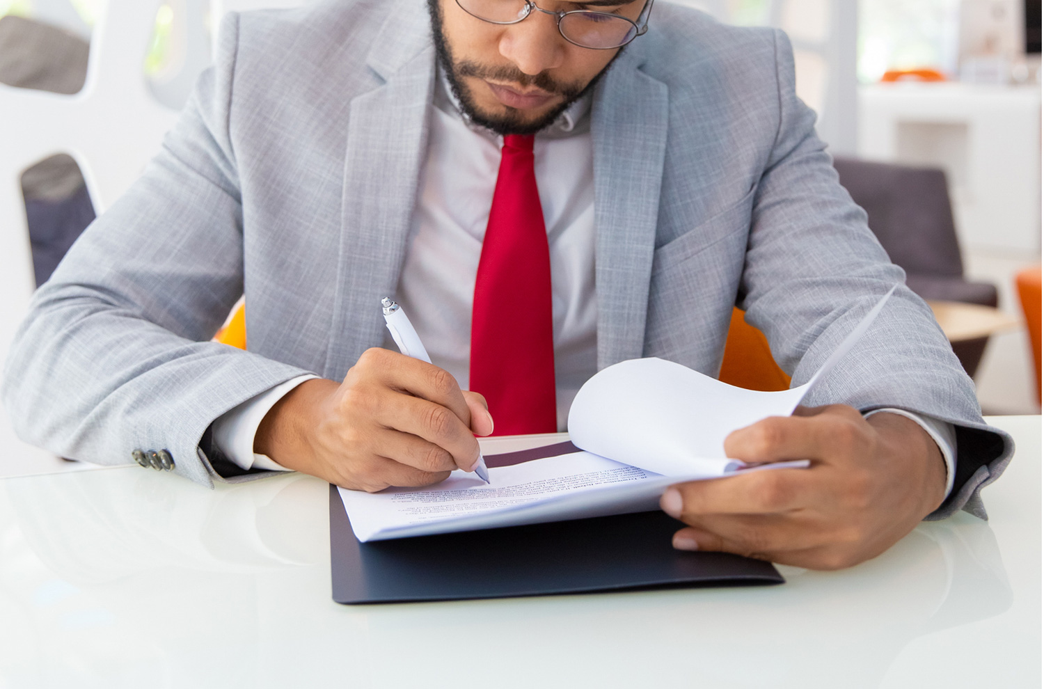 Businessman signing paperwork