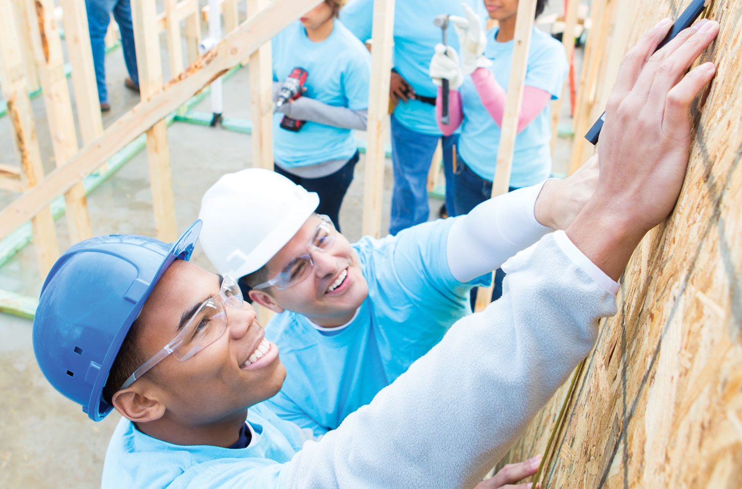 Habitat for Humanity volunteers building a house