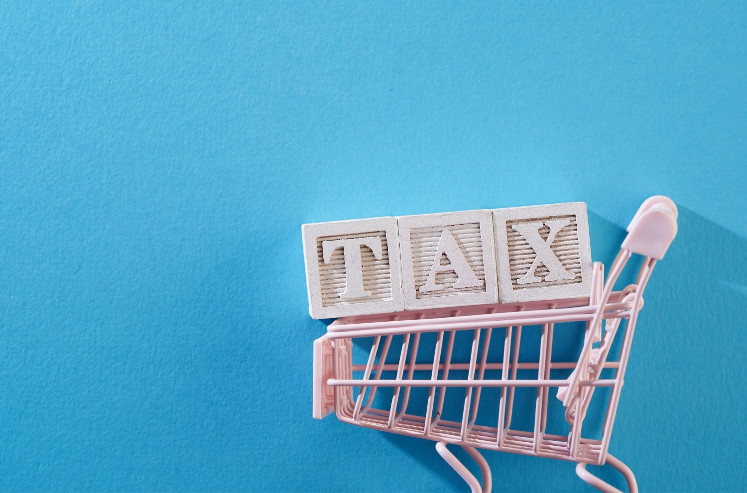 Tax letter blocks sitting inside a shopping cart